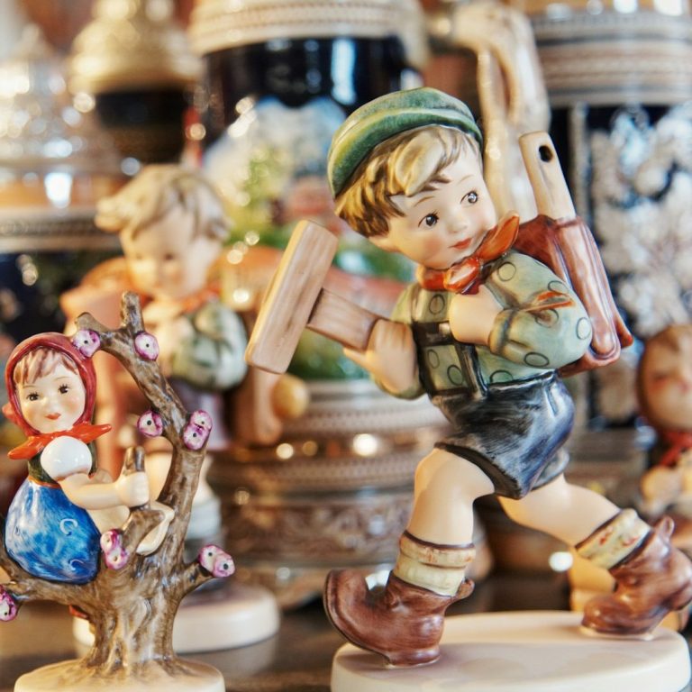 Porcelain boy Photo of porcelain doll dressed in swiss clothing to show the type of items you might find at our auctions